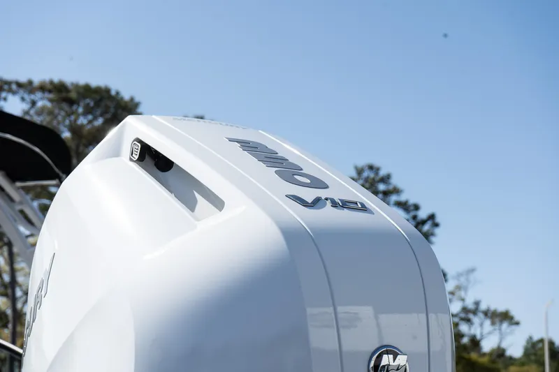 Slide: The Image of 2025 Monterey M-65 boat engine detail against a clear blue sky. - 8