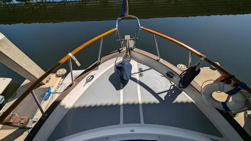 Slide: The Image of Bow view of 1982 Monk 36 boat docked at marina. - 16