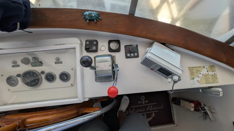 Slide: The Image of Control panel of a 1982 Monk 36 boat with gauges and navigation equipment. - 22