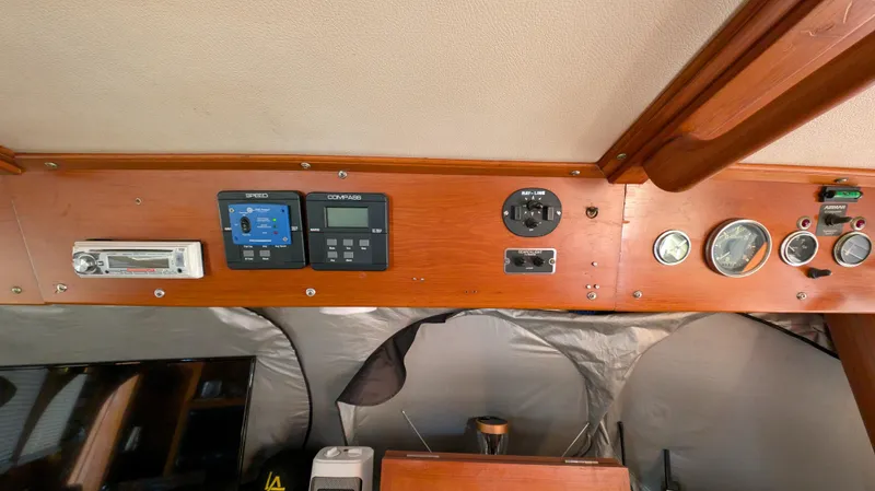 Slide: The Image of Control panel of a 1982 Monk 36 boat with gauges and electronic displays. - 33