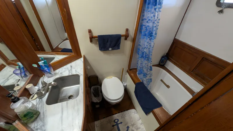 Slide: The Image of Bathroom in 1982 Monk 36 boat with sink, toilet, and bathtub. - 42