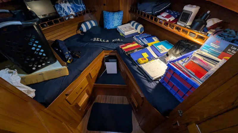 Slide: The Image of Cozy cabin interior of 1982 Monk 36 boat with organized storage and nautical decor. - 45
