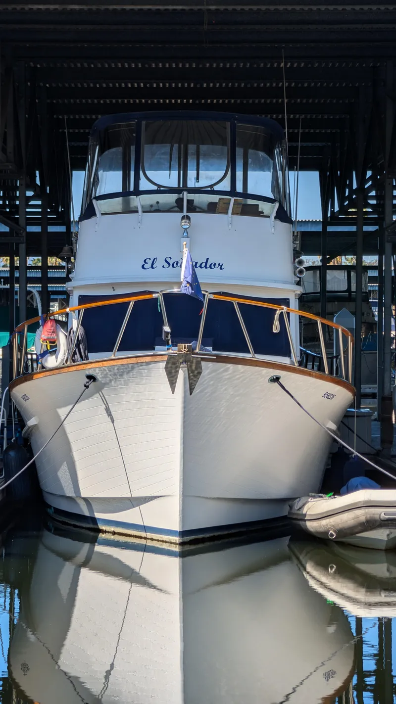 Slide: The Image of 1982 Monk 36 boat named "El Salvador" docked in a marina. - 5