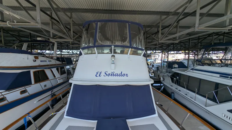 Slide: The Image of 1982 Monk 36 yacht "El Soñador" docked in a covered marina. - 7