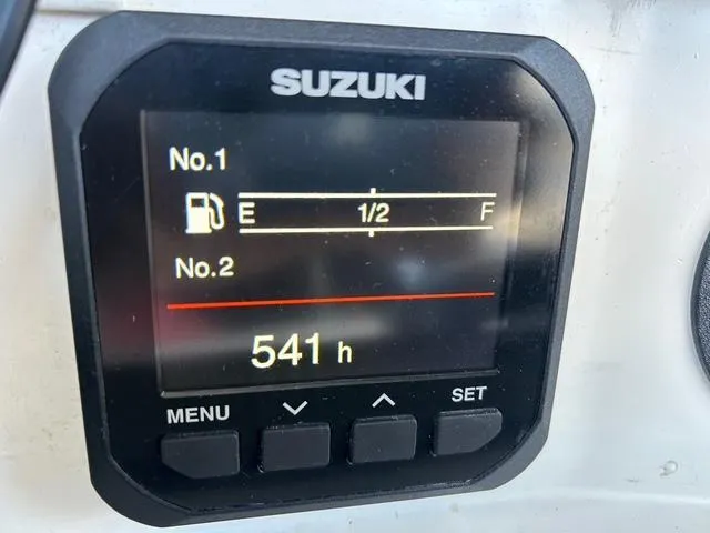 Slide: The Image of Suzuki display showing fuel level and 541 hours on Venture 34 Center Console, 2002 model. - 17