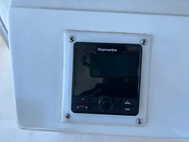 Slide: The Image of Raymarine control panel on 2002 Venture 34 Center Console boat dashboard. - 19