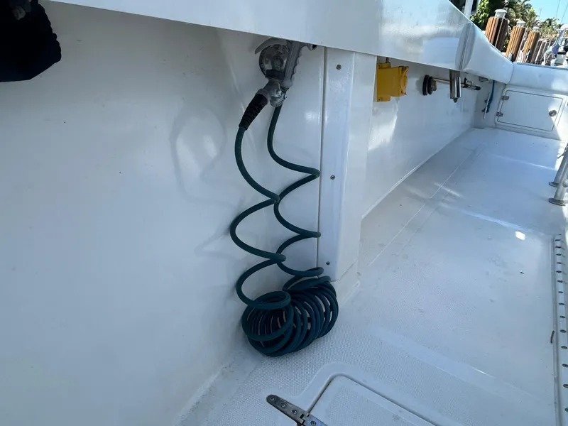 Slide: The Image of Coiled hose on 2002 Venture 34 Center Console boat deck. - 32