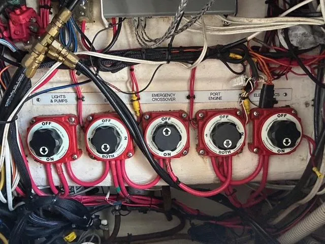 Slide: The Image of Electrical panel with switches and wiring in a 2002 Venture 34 Center Console boat. - 45