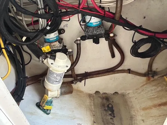 Slide: The Image of Electrical wiring and components inside a 2002 Venture 34 Center Console boat. - 46