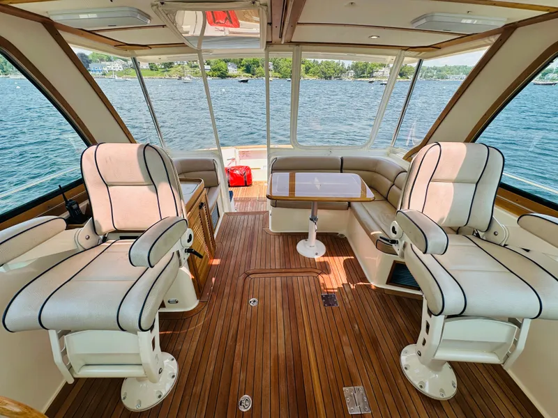 Slide: The Image of Luxurious interior of 2008 Sabre 42 Hardtop Express yacht with plush seating and wooden flooring. - 22