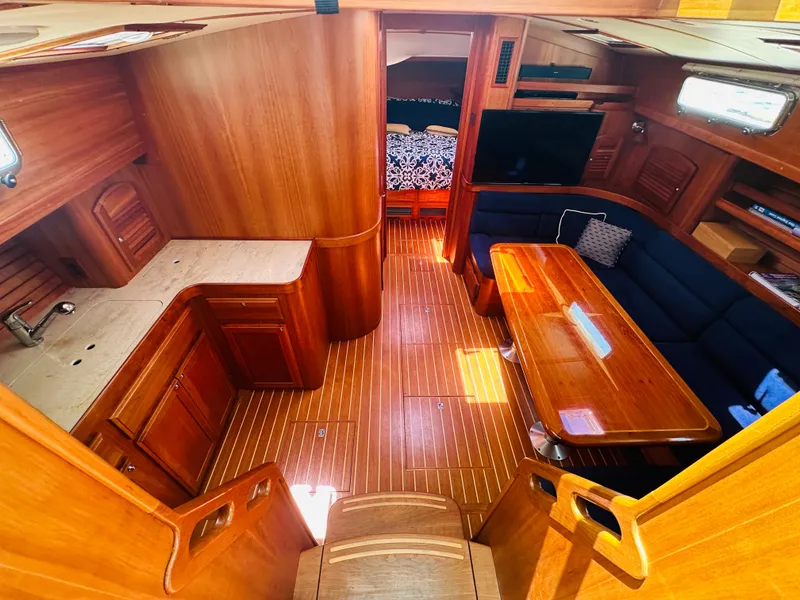 Slide: The Image of Interior of 2008 Sabre 42 Hardtop Express yacht with wood finish and seating area. - 25