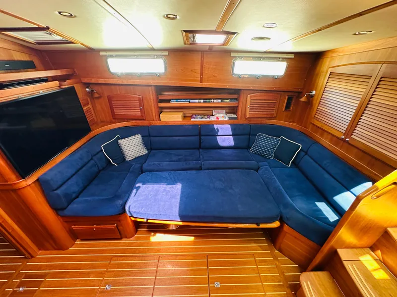 Slide: The Image of Luxurious interior of 2008 Sabre 42 Hardtop Express with blue seating and wooden accents. - 38