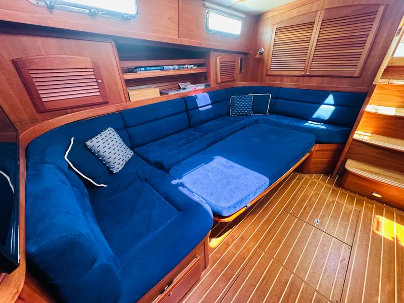 Slide: The Image of Luxurious interior of 2008 Sabre 42 Hardtop Express with blue seating and wooden accents. - 39