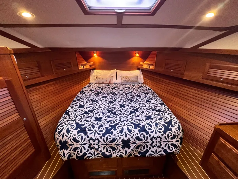 Slide: The Image of Luxurious cabin interior of 2008 Sabre 42 Hard Top Express with elegant bedding. - 41