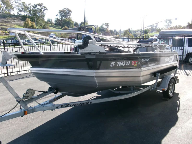 Slide: The Image of 2023 Stabicraft 1550 Frontier Profish boat on trailer in outdoor setting. - 1