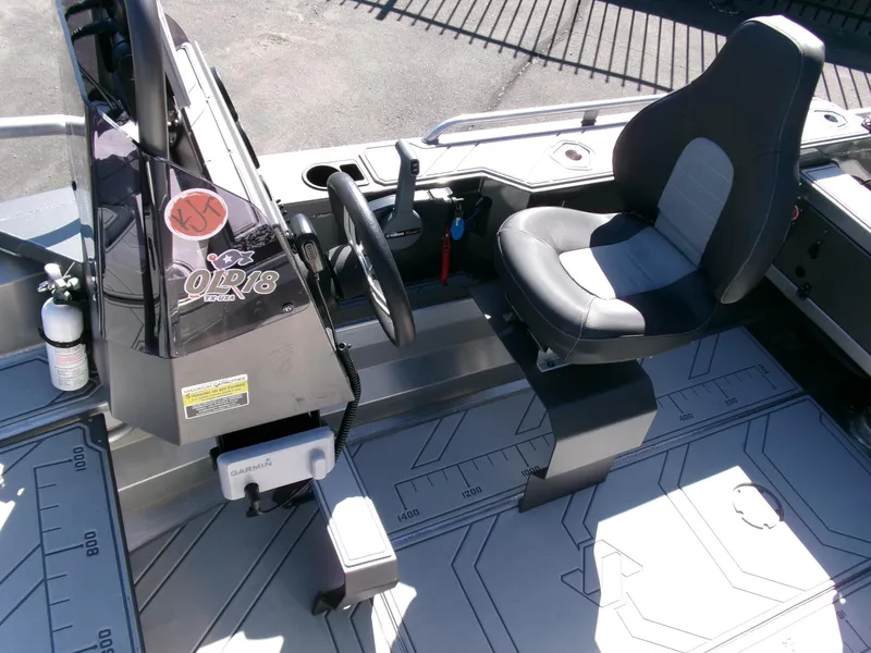 Slide: The Image of 2023 Stabicraft 1550 Frontier Profish series boat interior with steering wheel and seat. - 12