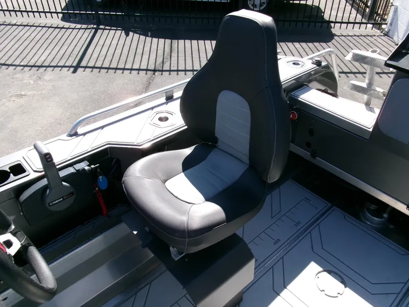 Slide: The Image of 2023 Stabicraft 1550 Frontier Profish boat interior with a comfortable captain's seat. - 14