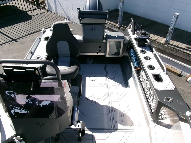 Slide: The Image of 2023 Stabicraft 1550 Frontier Profish boat interior with seating and fishing equipment. - 15