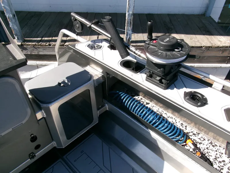 Slide: The Image of 2023 Stabicraft 1550 Frontier Profish series boat interior with fishing equipment and storage. - 19