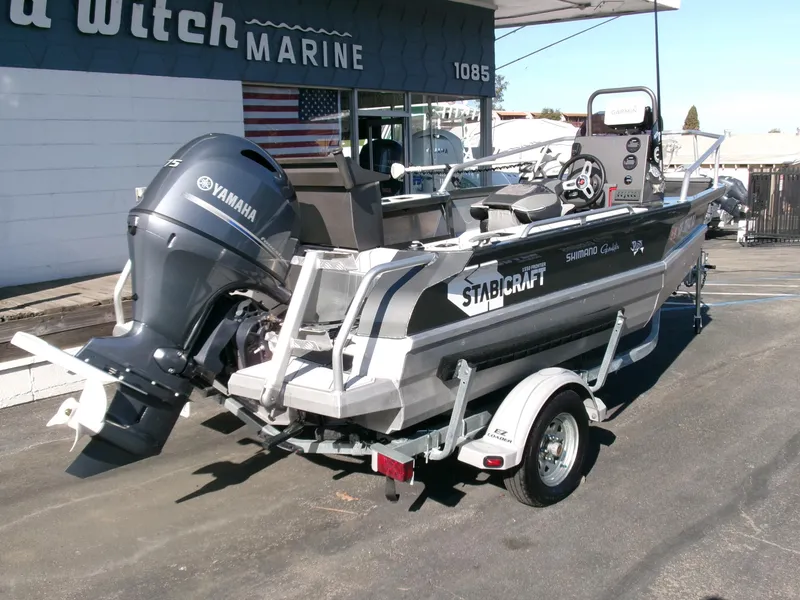 Slide: The Image of 2023 Stabicraft 1550 Frontier Profish boat with Yamaha engine on trailer. - 2