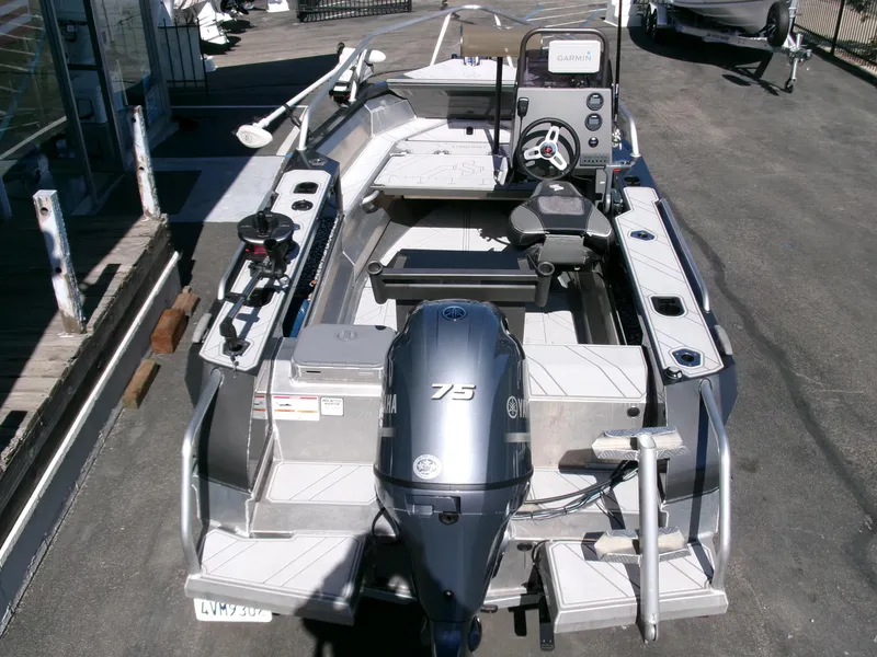 Slide: The Image of 2023 Stabicraft 1550 Frontier Profish boat with Yamaha 75 engine, docked outdoors. - 25