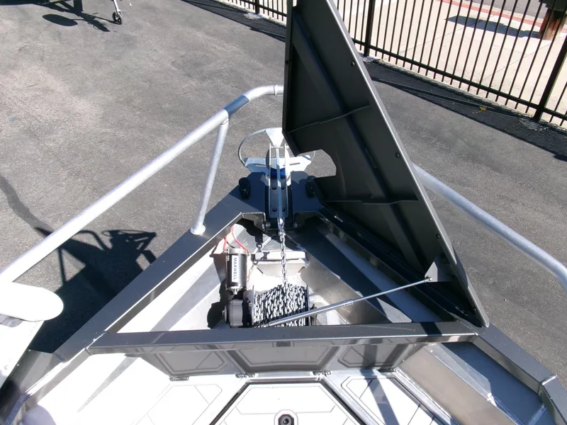 Slide: The Image of 2023 Stabicraft 1550 Frontier Profish boat bow with anchor and storage compartment. - 5