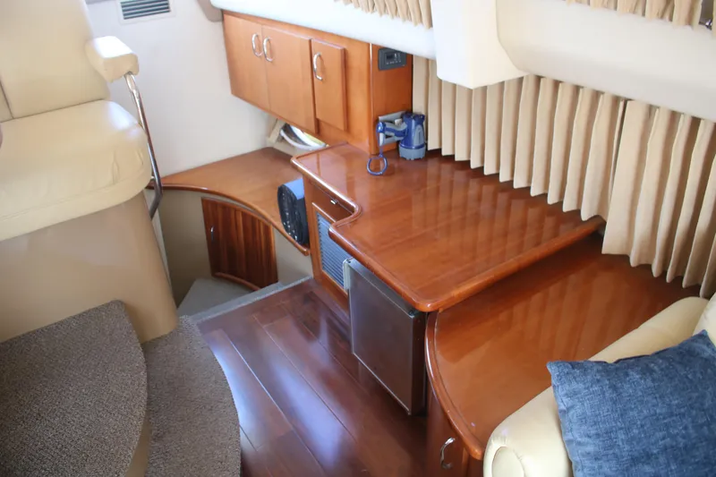 Slide: The Image of Interior of 2004 Carver 360 Sport Sedan with wood finishes and seating area. - 21