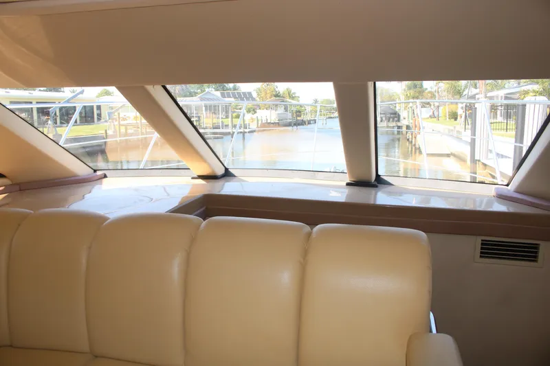Slide: The Image of Interior view of 2004 Carver 360 Sport Sedan with beige seating and large windows. - 22