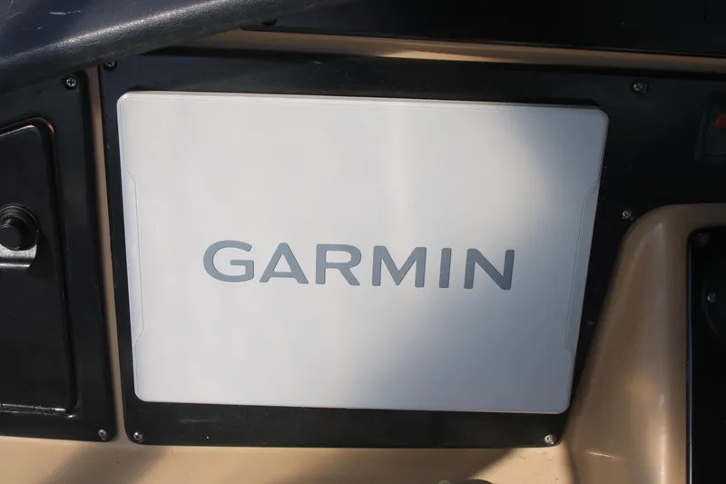 Slide: The Image of Garmin navigation system on 2004 Carver 360 Sport Sedan dashboard. - 26