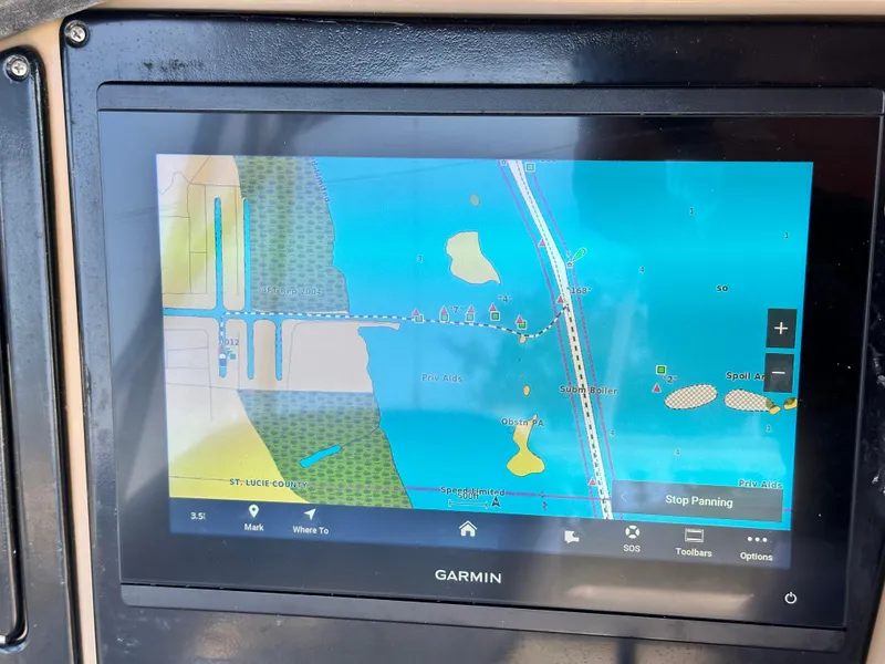 Slide: The Image of Garmin navigation display on 2004 Carver 360 Sport Sedan, showing coastal map and route details. - 8