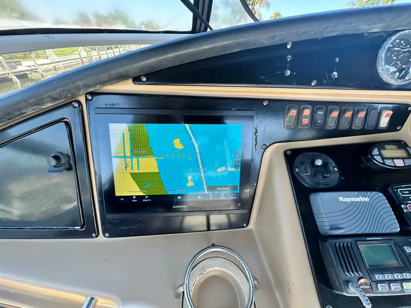 Slide: The Image of Dashboard of a 2004 Carver 360 Sport Sedan with navigation display and controls. - 9