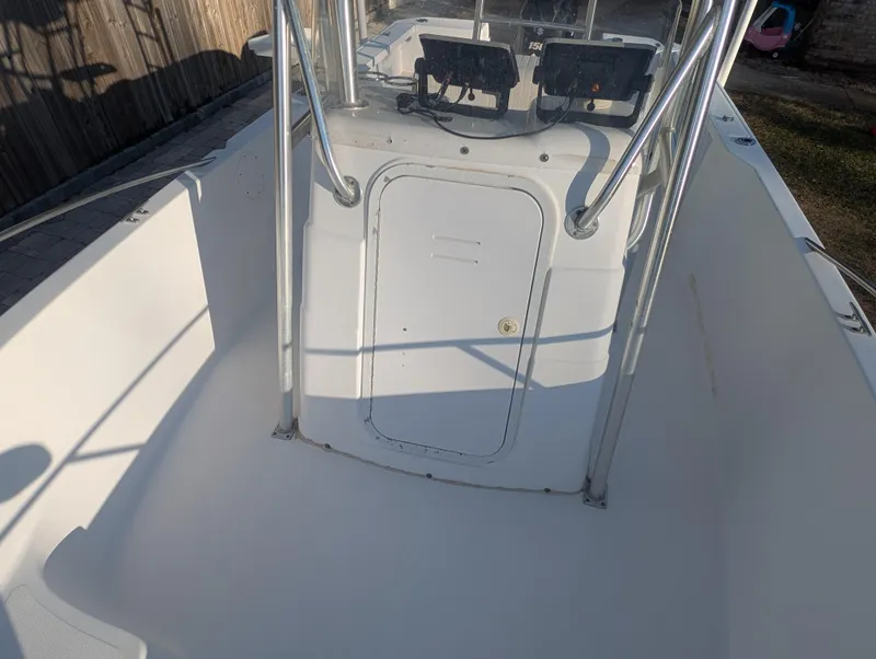 Slide: The Image of 2003 Pro-Line 22 Sport boat interior with console and railing. - 13