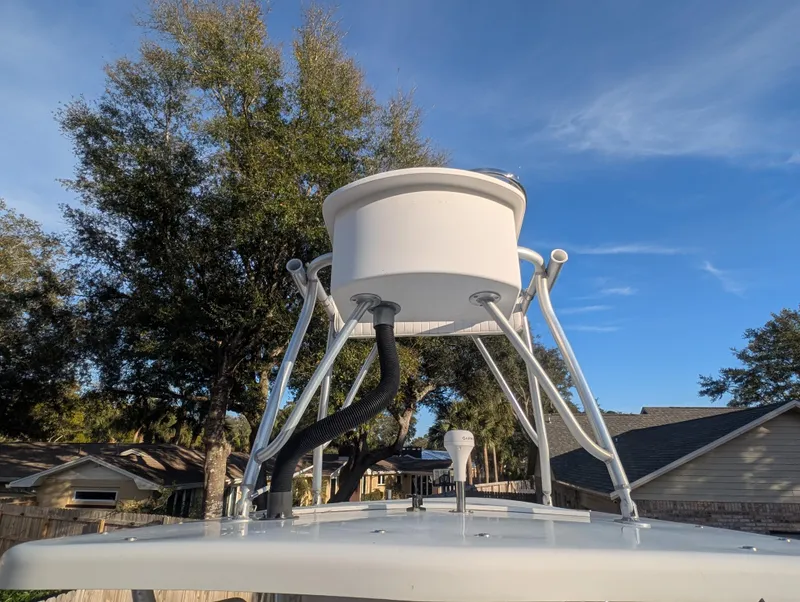 Slide: The Image of 2003 Pro-Line 22 Sport boat with radar, clear sky, and trees in the background. - 14