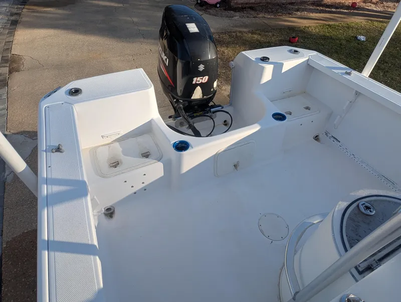 Slide: The Image of 2003 Pro-Line 22 Sport boat deck with Suzuki 150 outboard motor. - 17