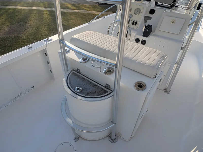 Slide: The Image of 2003 Pro-Line 22 Sport boat interior with seating and control panel. - 18