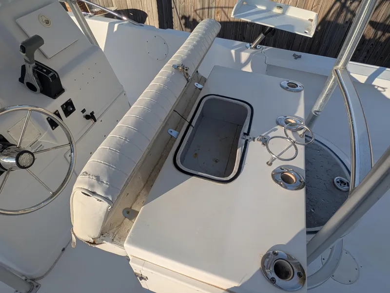 Slide: The Image of 2003 Pro-Line 22 Sport boat interior with steering wheel and seating area. - 21