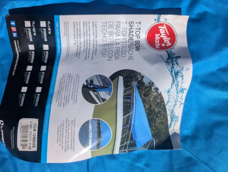 Slide: The Image of Taylor Made T-Top Bow Shade brochure on blue fabric, featuring Pro-Line 22 Sport 2003. - 32