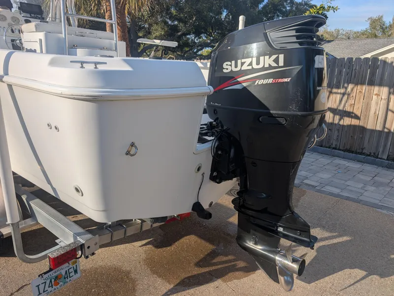 Slide: The Image of 2003 Pro-Line 22 Sport boat with Suzuki outboard motor on a trailer. - 4