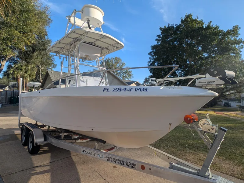 Slide: The Image of 2003 Pro-Line 22 Sport boat on trailer, parked outdoors, clear sky background. - 7