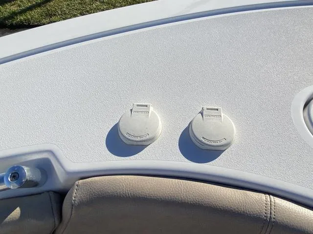 Slide: The Image of 2020 Sportsman Open 242 boat deck with two white flush-mounted hatches. - 16