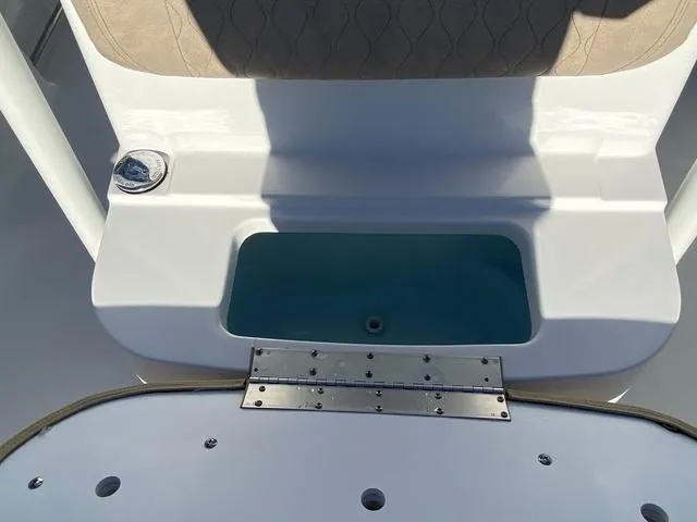 Slide: The Image of 2020 Sportsman Open 242 boat interior with seating and storage compartment. - 18