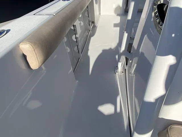 Slide: The Image of 2020 Sportsman Open 242 boat interior with seating and storage compartments. - 21