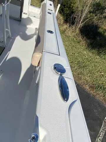 Slide: The Image of 2020 Sportsman Open 242 boat deck with seating and rod holders. - 22