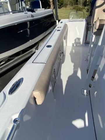 Slide: The Image of 2020 Sportsman Open 242 boat interior with seating and storage compartments. - 24