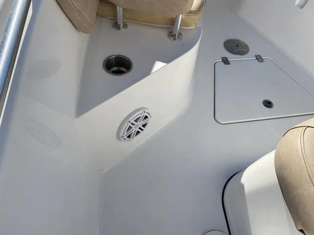 Slide: The Image of 2020 Sportsman Open 242 boat interior with seating and storage compartments. - 29