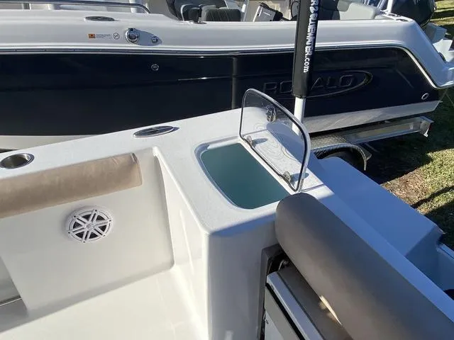 Slide: The Image of 2020 Sportsman Open 242 boat interior with seating and storage compartment. - 37