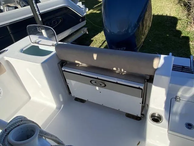 Slide: The Image of 2020 Sportsman Open 242 boat interior with seating and storage compartment. - 38