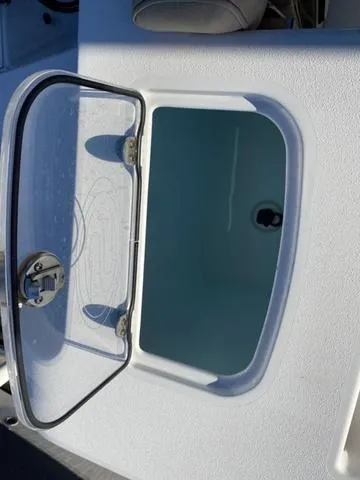 Slide: The Image of Open storage compartment on a 2020 Sportsman Open 242 boat. - 43