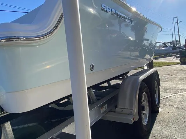 Slide: The Image of 2020 Sportsman Open 242 boat on trailer, side view in sunlight. - 5