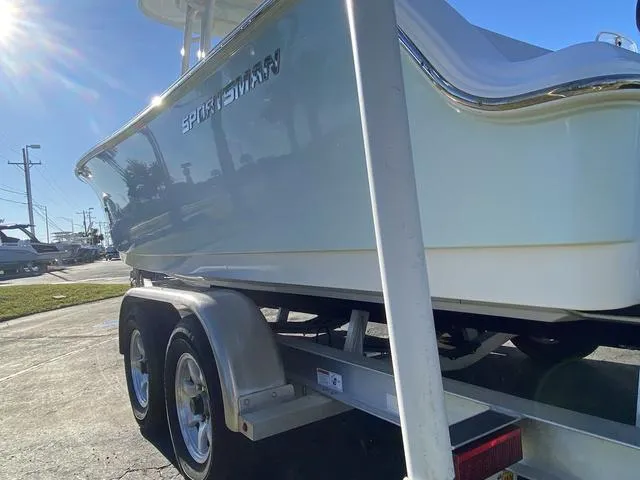 Slide: The Image of 2020 Sportsman Open 242 boat on trailer, side view in sunlight. - 6